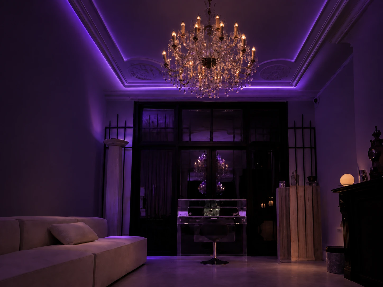 Communal lounge at REGÊNT House with violet lighting and chandelier